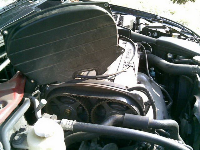 Снятие верхней крышки ремня привода газораспределительного механизма двигателя 4G63 Mitsubishi Outlander I