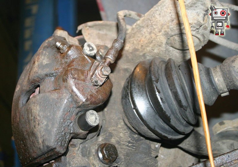 Пыльник ШРУСа и суппорт тормозного механизма Volkswagen Passat B6 2005-2010