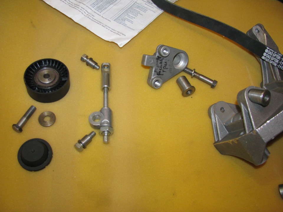 Disassembled alternator bracket with tensioner for Lada Granta (VAZ 2190)