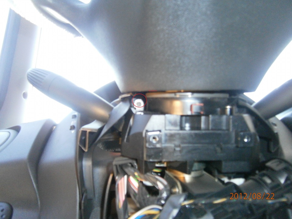 Unscrew 4 Phillips screws from the bottom and 2 from the top to remove the upper protection of the Fiat Doblo dashboard